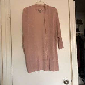 Long light pink cardigan.